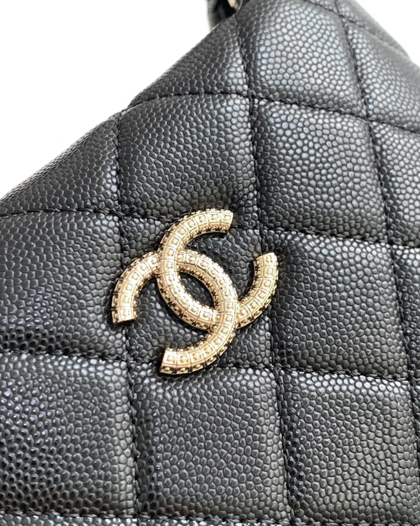 Black Quilted Short-Handle Shoulder Bag — ornament detail view