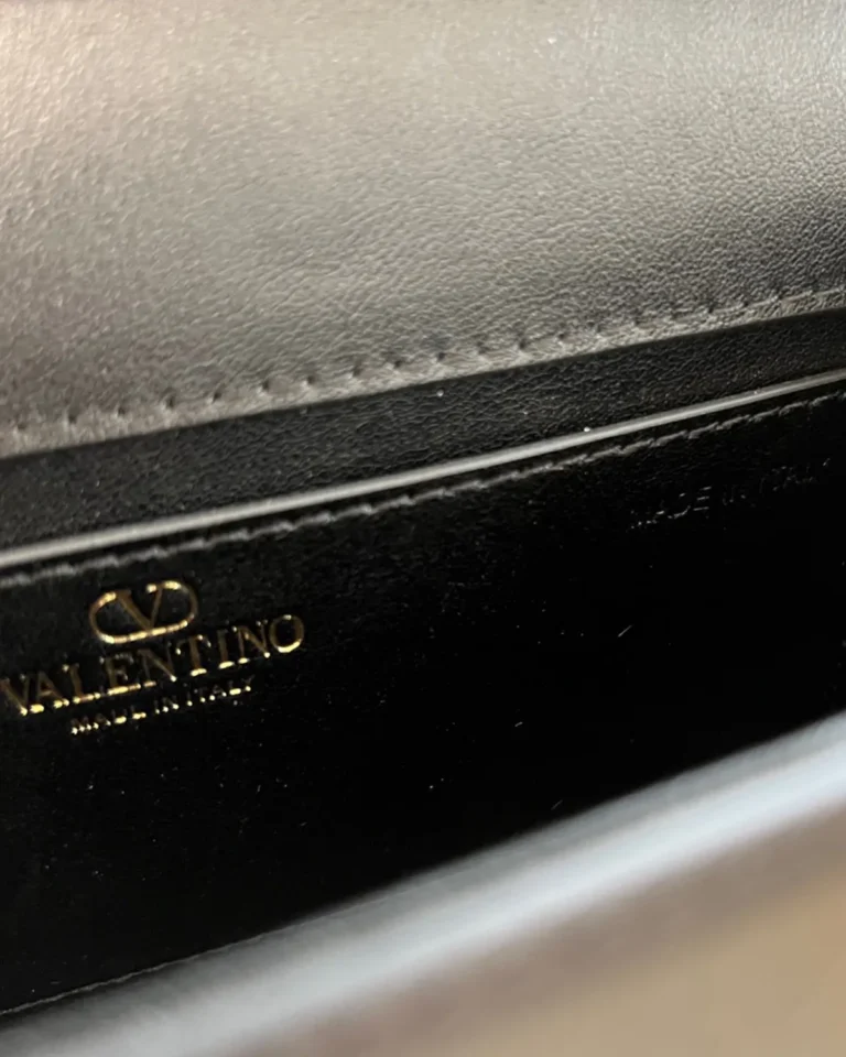 Black Stone-Detail Flap Shoulder Bag — interior lettering view