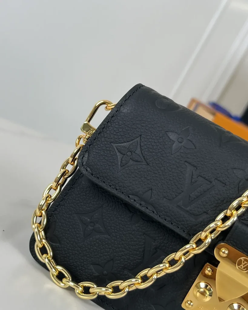 Black Embossed Flap Chain Wallet — chain detail view