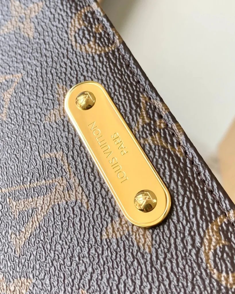 Brown Monogram Lily-Inspired Chain Wallet — front plate detail view