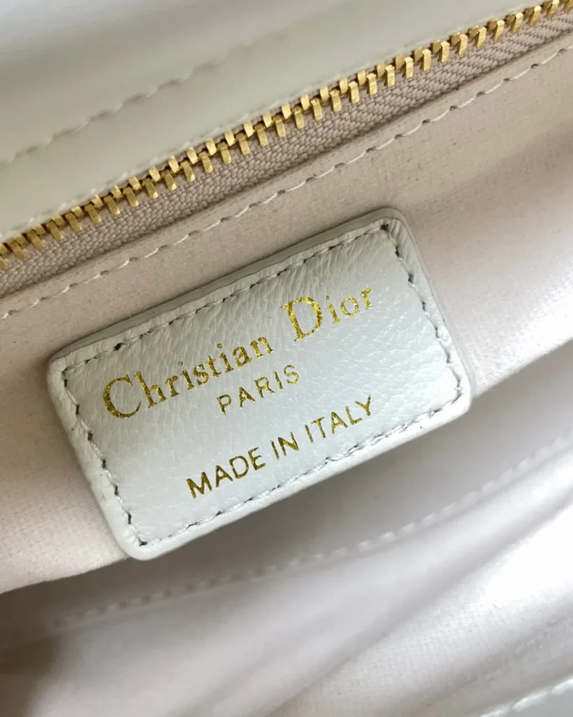 Ivory Butterfly Stud Quilted Top Handle Bag — interior label view
