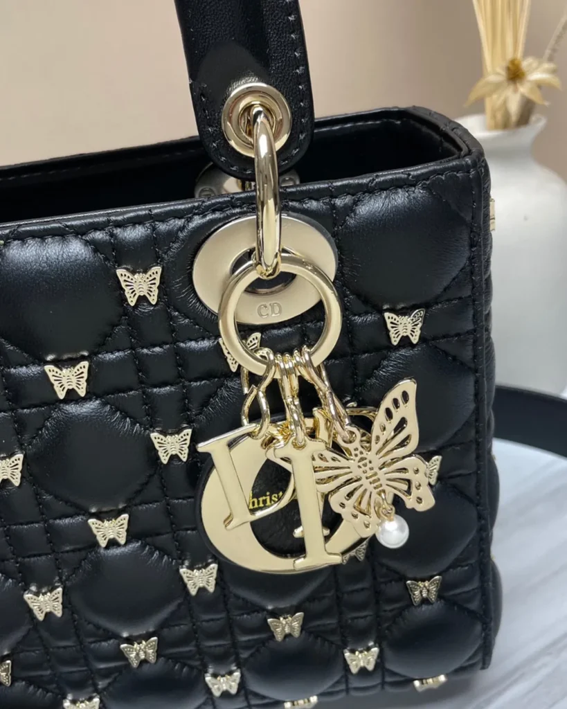 Black Butterfly-Embellished Top Handle Bag — charm detail view