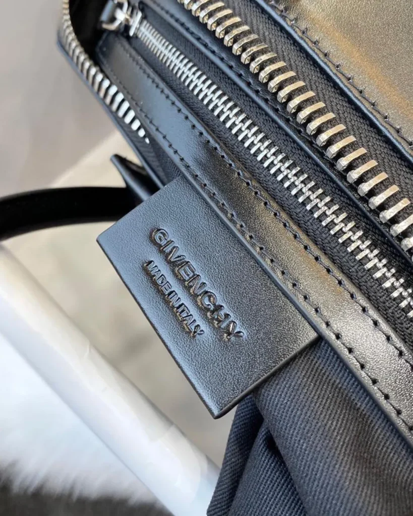 Black Architectural Top Handle Bag — interior label view