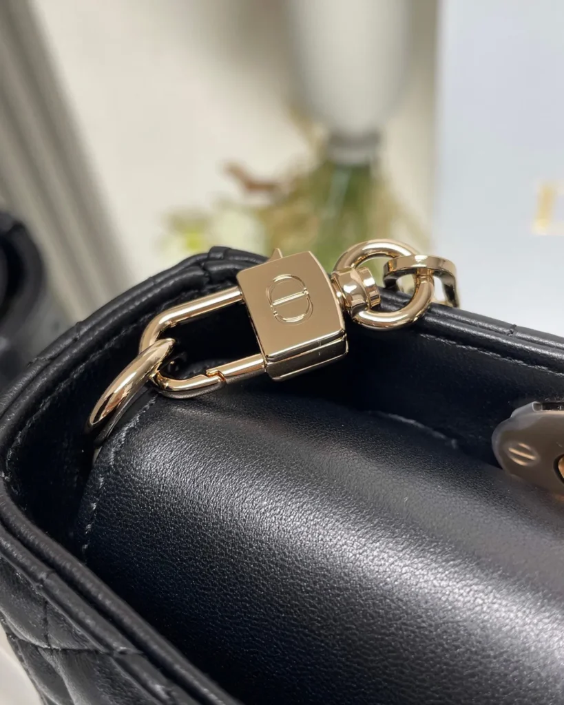 Black Quilted Chain Top Handle Bag — clip detail view