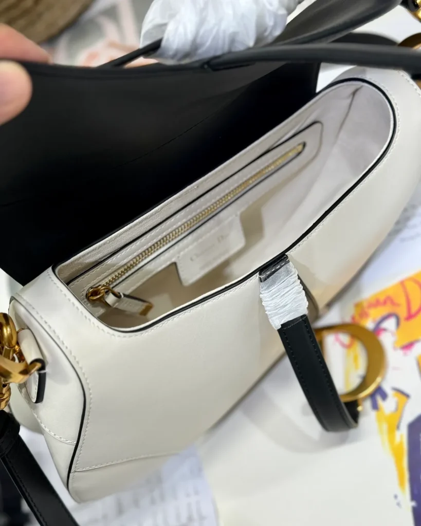 Cream and Black Asymmetric Saddle Bag — interior view