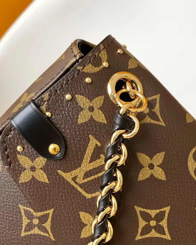 Brown Monogram Chain Flap Bag — chain attachment view