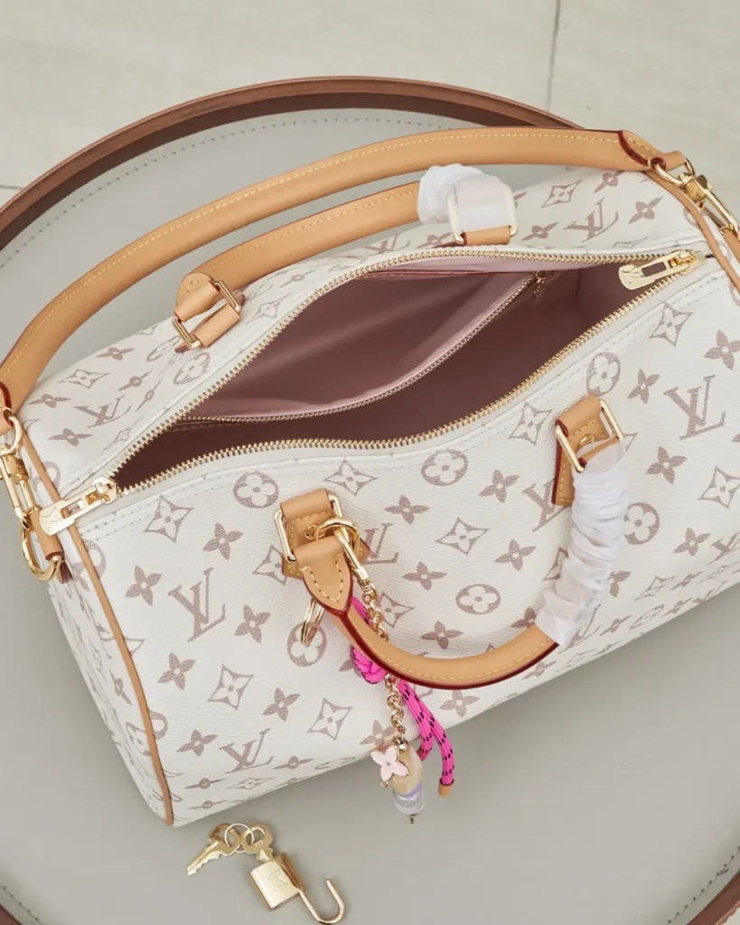 Cream Monogram Top-Handle Bag with Colorful Charms — interior view