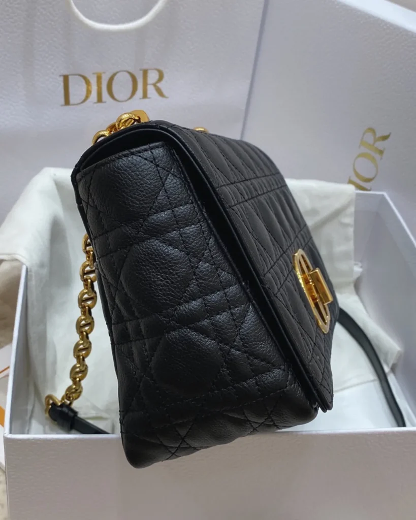 Black Quilted Flap Bag with Gold Tone Clasp — side view