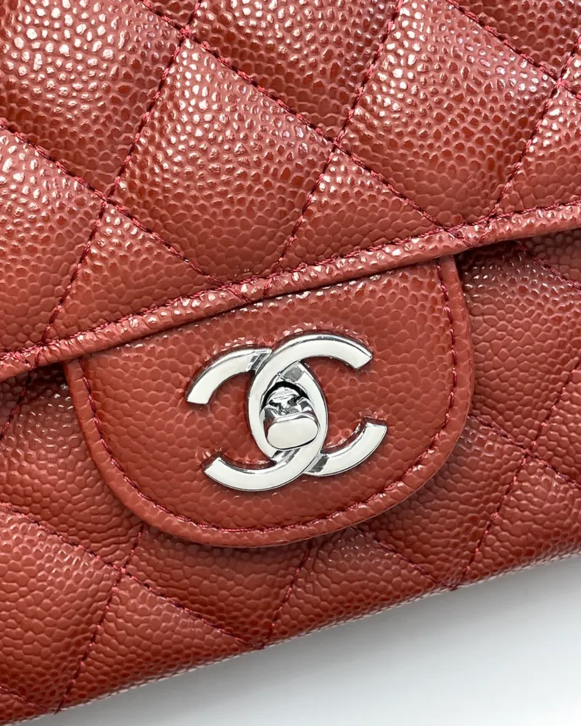 Rust Red Quilted Chain Flap Bag — logo detail view
