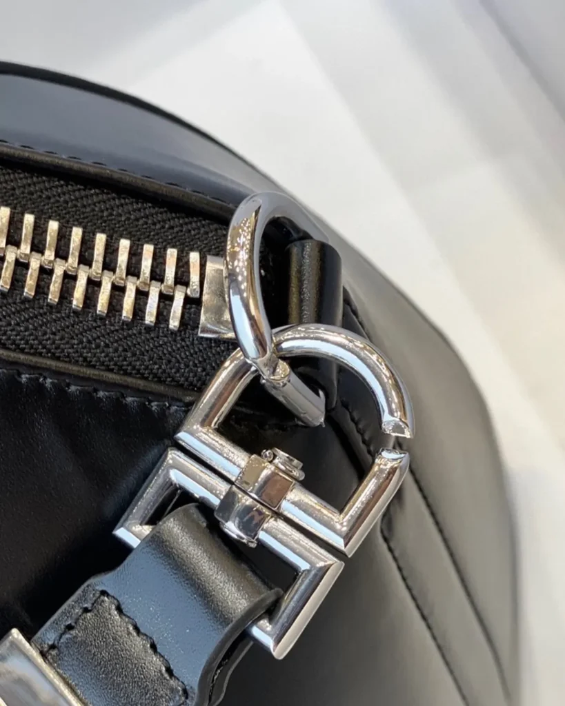 Black Architectural Top Handle Bag — clip detail view