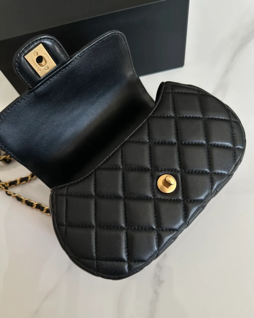 Black Rounded Quilted Top-Handle Bag — open flap view