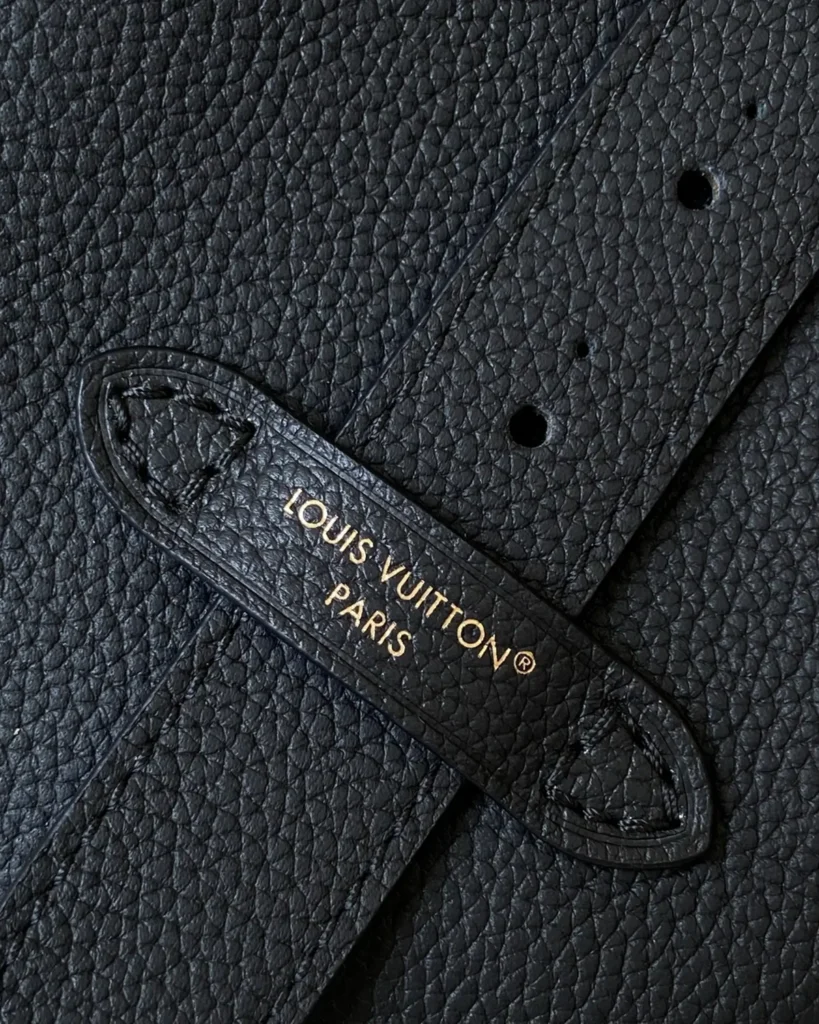 Black Curved Top Bucket Bag with Padlock — strap detail view