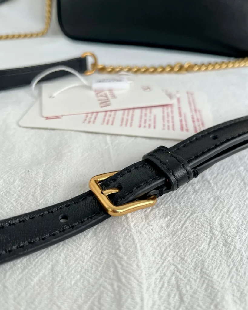 Black and Tan V-Panel Top-Handle Bag — strap detail view