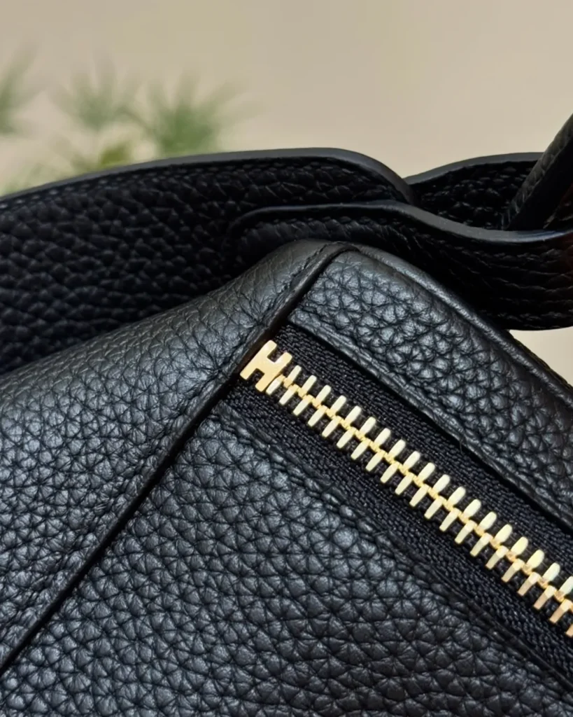 Black Folded Shoulder Bag with Gold-Tone Details — zip view
