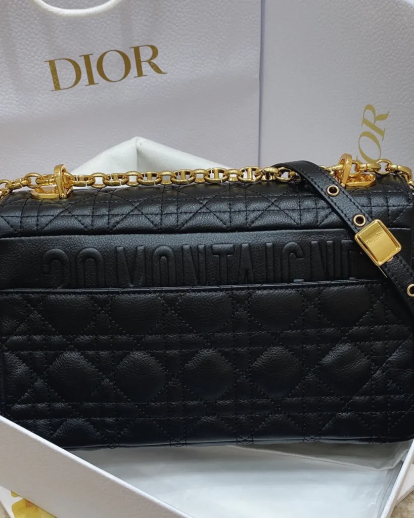 Black Quilted Flap Bag with Gold Tone Clasp — rear view