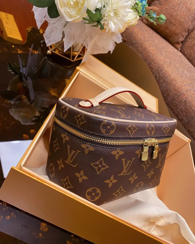 Brown Monogram Top Handle Vanity Case — angled front view