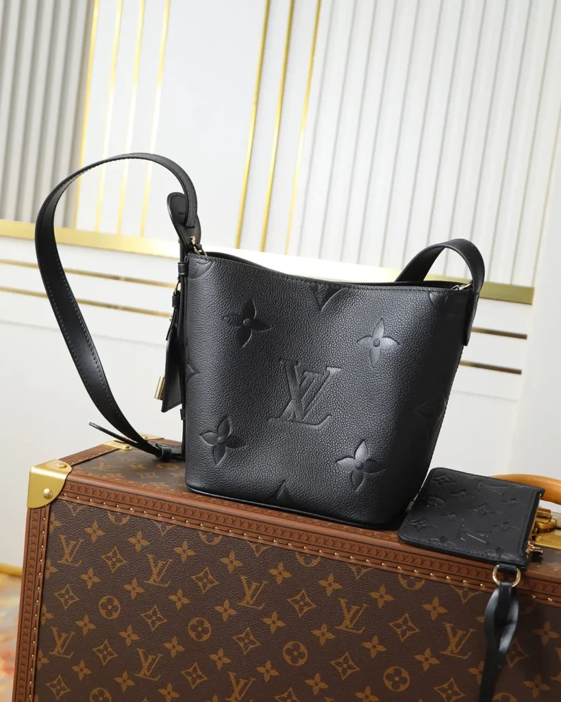 Black Embossed Monogram Bucket Bag — front view