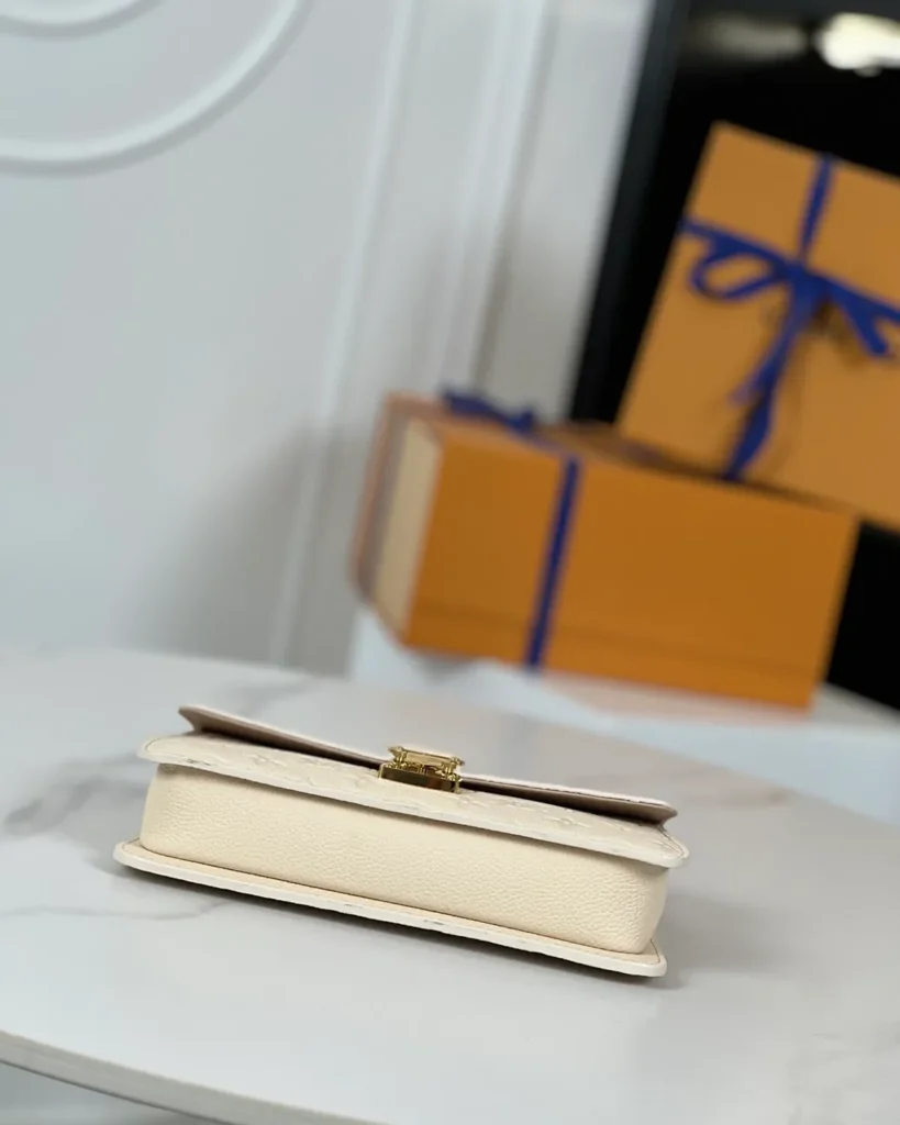 Cream Embossed Flap Chain Wallet — base view