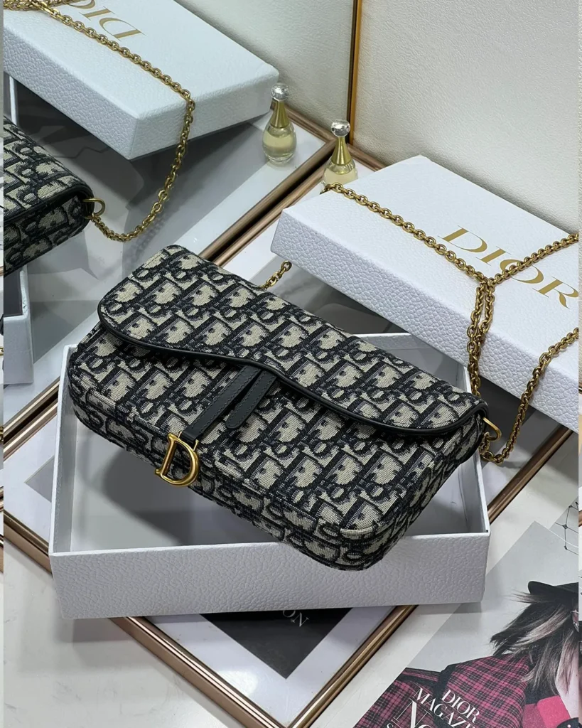 Navy Monogram Asymmetric Chain Pouch — flap detail view