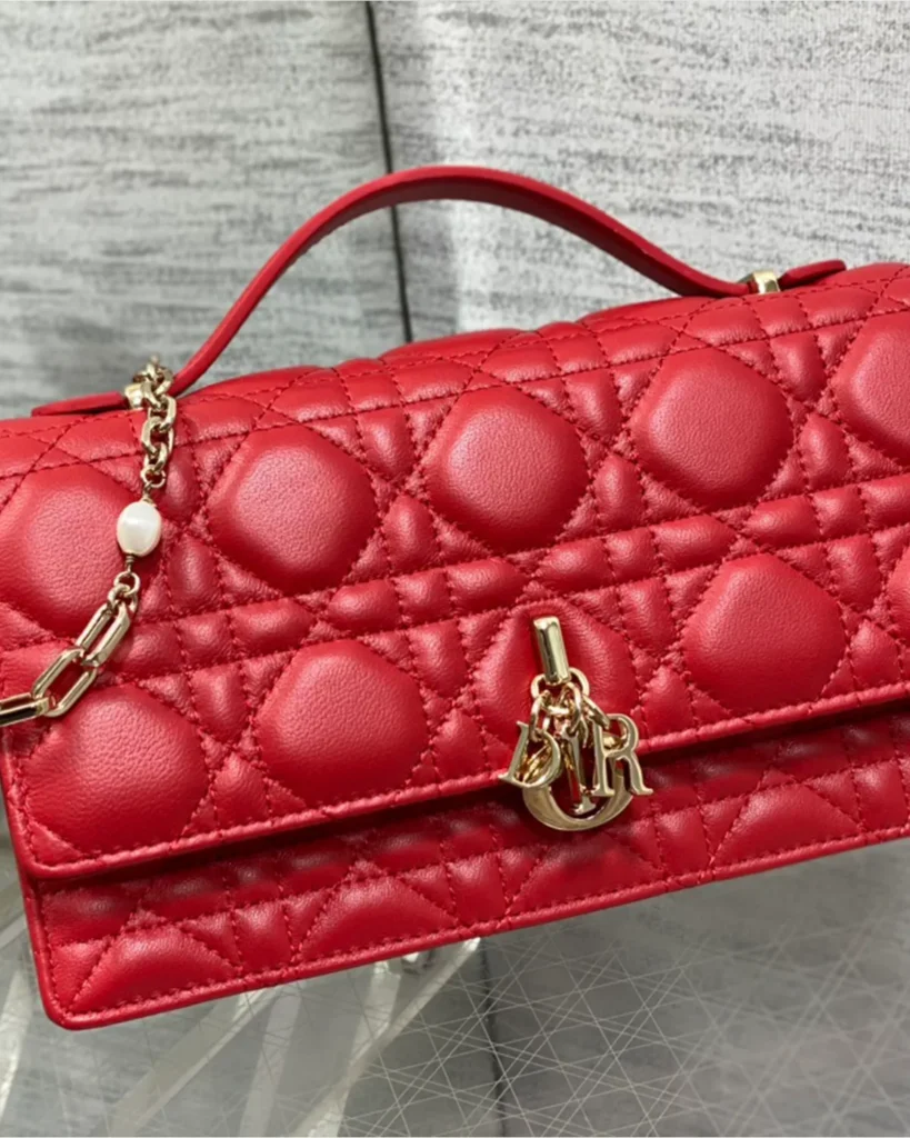 Red Quilted Top Handle Flap Bag — angled front view