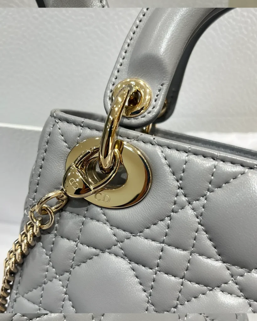 Pearlescent Gray Quilted Top Handle Bag — hardware detail view