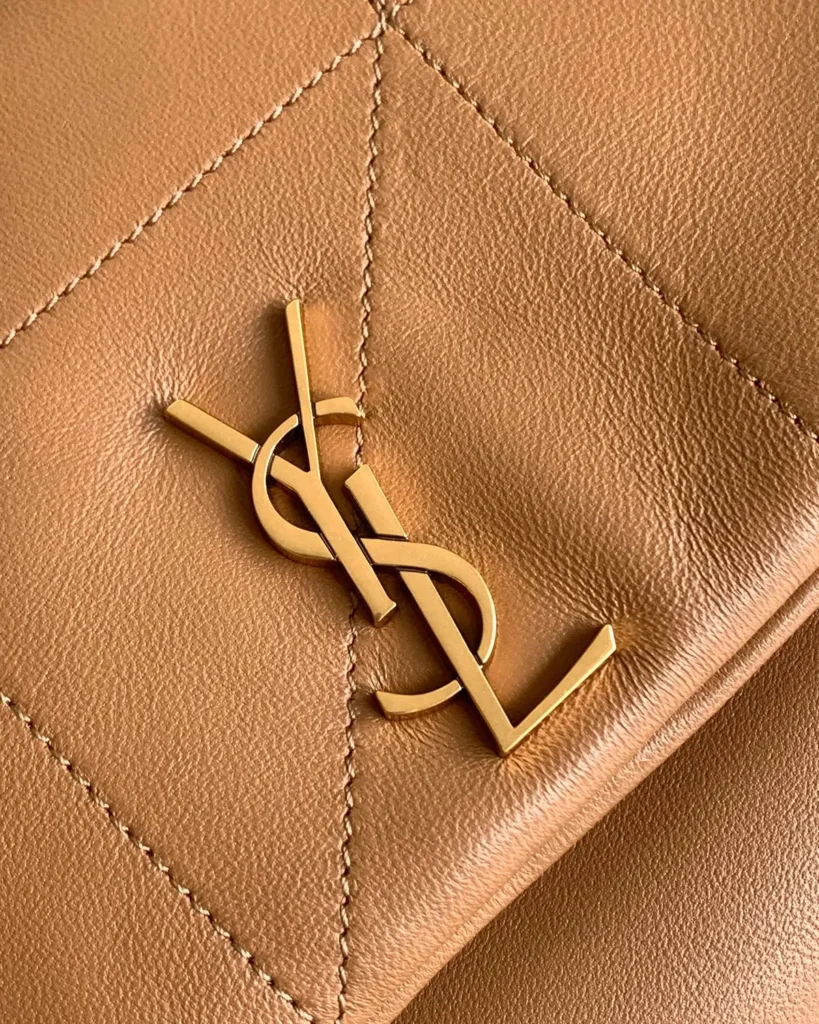 Caramel Geometric Flap Chain Bag — emblem view