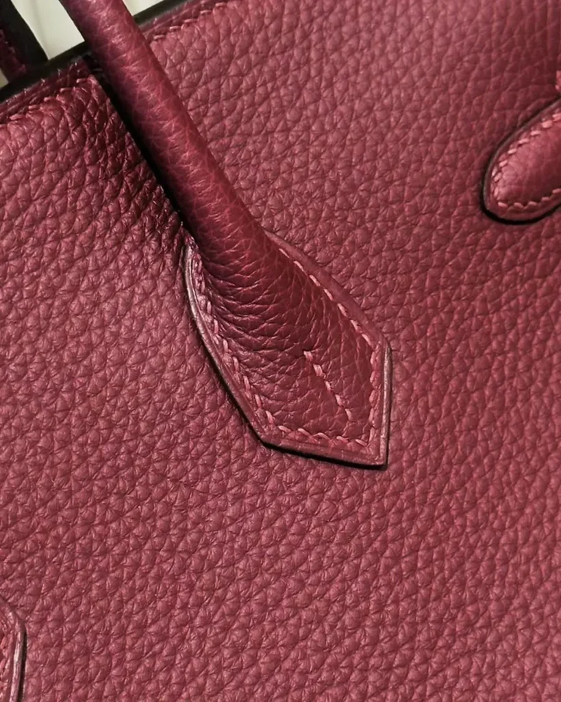 Burgundy Grained Top-Handle Bag — handle base view