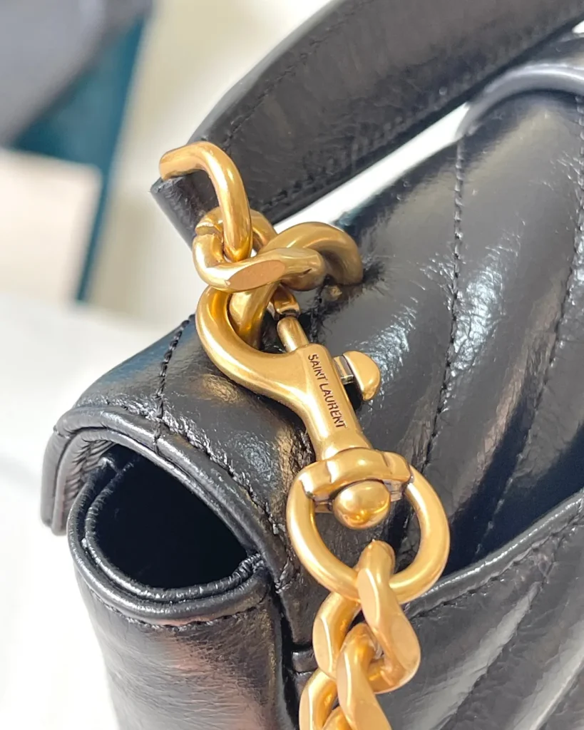 Black Chevron Top-Handle Flap Bag — strap detail view
