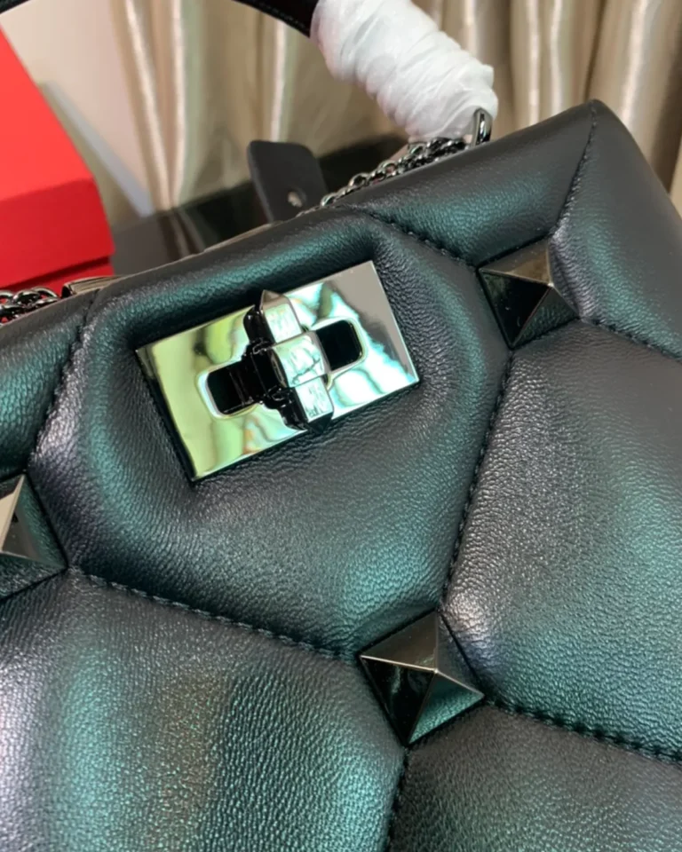 Black Diamond-Quilted Studded Top-Handle Bag — closure detail view