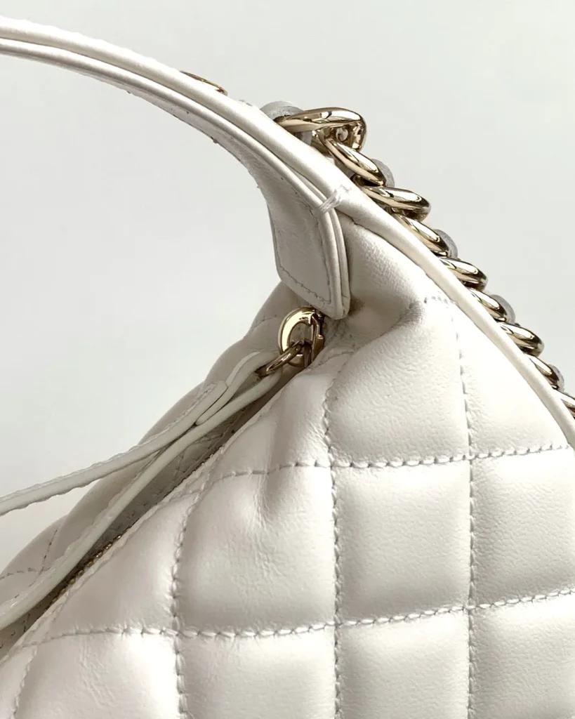 Ivory Quilted Round Chain-Edge Bag — handle detail view