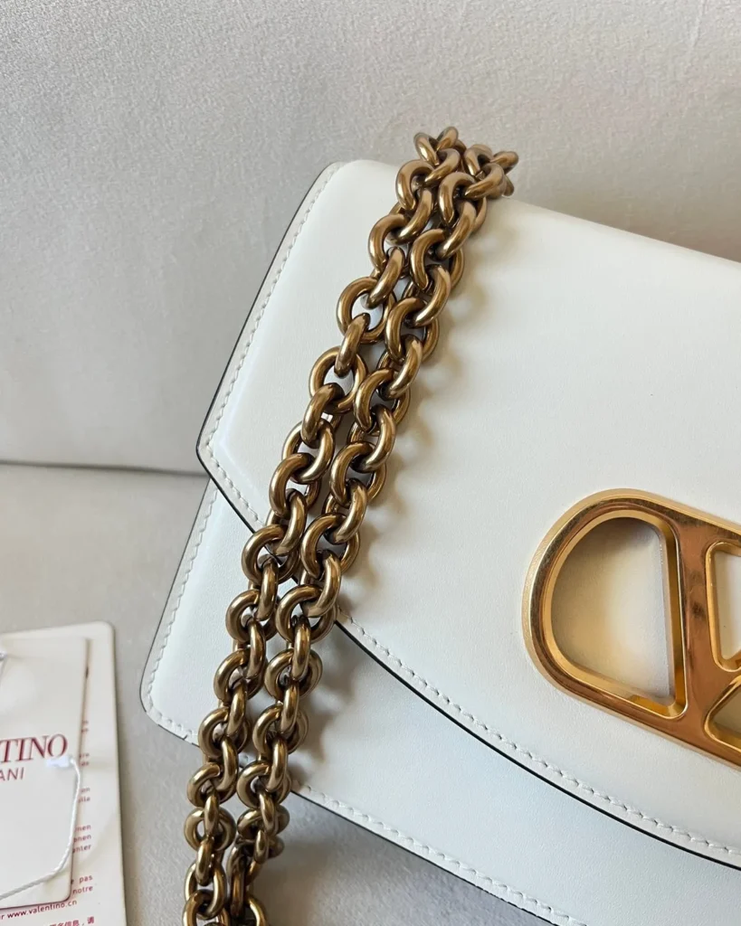 Ivory Curved-Flap Chain Shoulder Bag — chain detail view