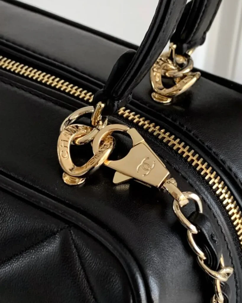Black Quilted Bowling Bag — strap clip view