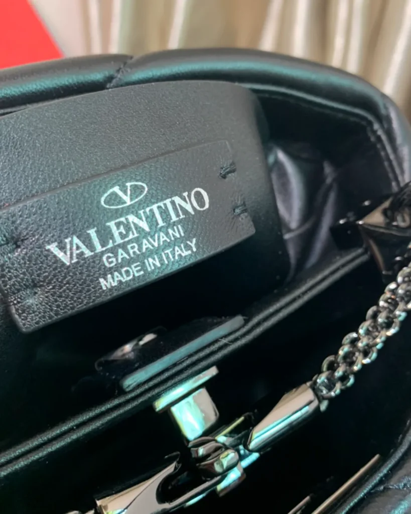 Black Diamond-Quilted Studded Top-Handle Bag — interior label view
