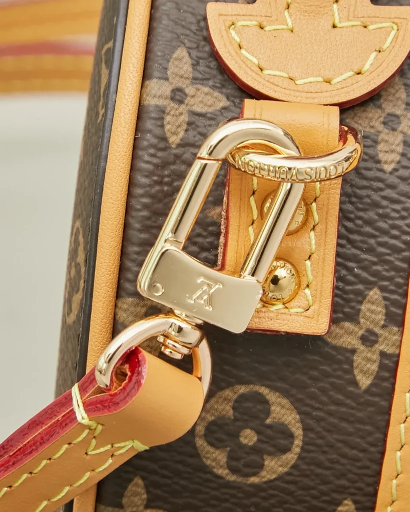 Brown Monogram Round Crossbody Bag — strap clasp view
