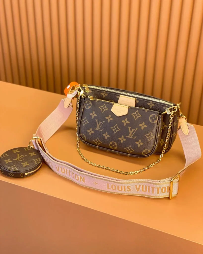 Brown Monogram Multi-Pouch Bag with Pink Strap — three quarter view