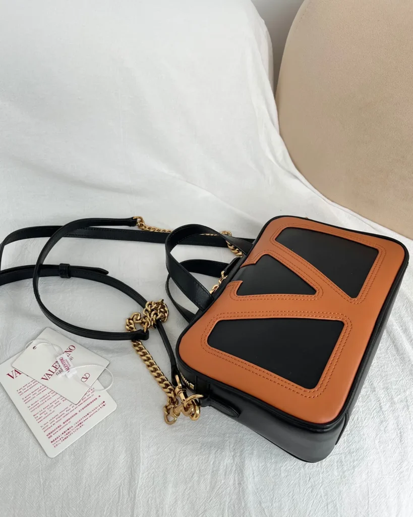 Black and Tan V-Panel Top-Handle Bag — top view