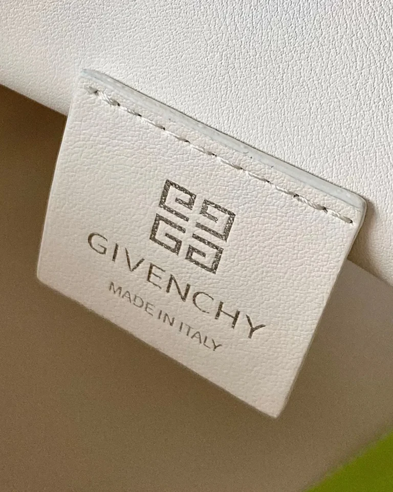 Ivory Ruched Chain Pouch — label detail