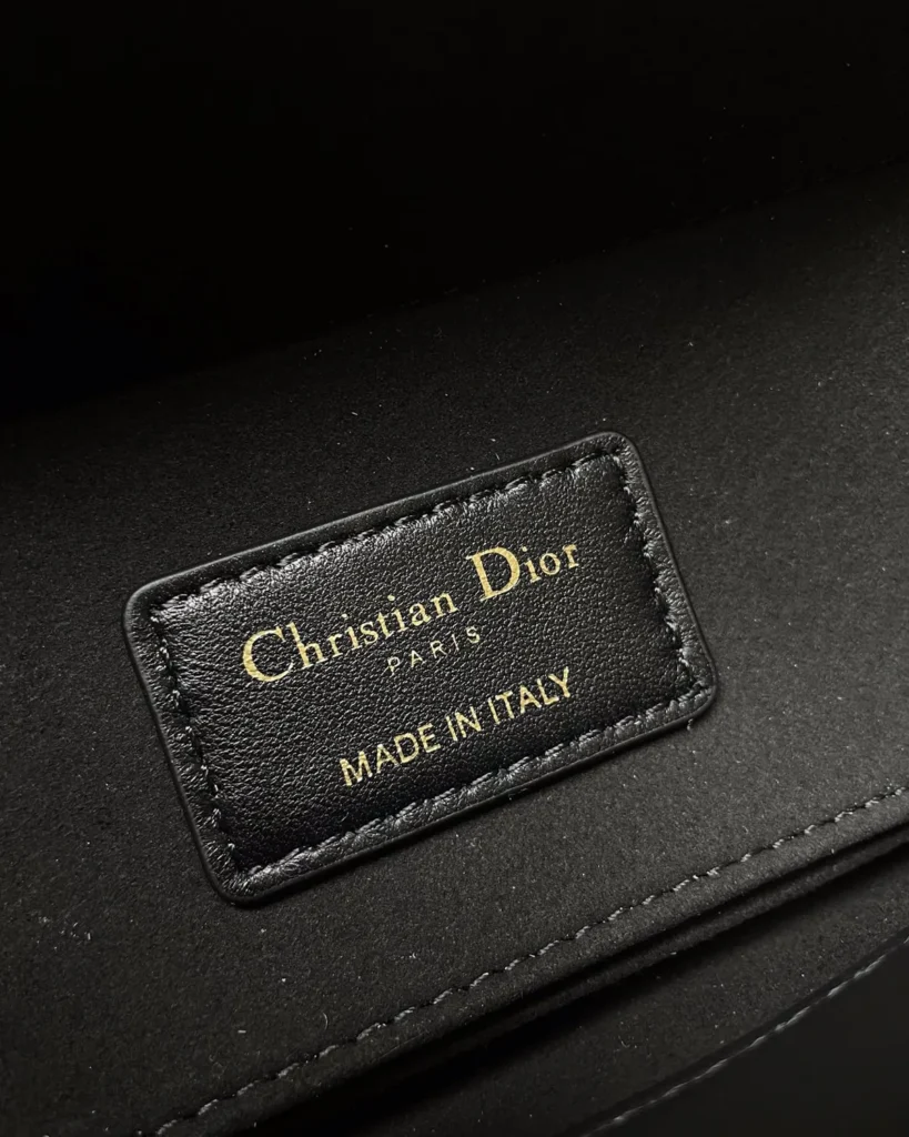 Black Quilted Chain Top Handle Bag — interior label view