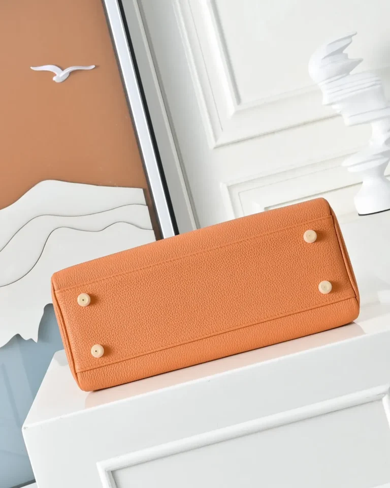 Kelly-Inspired 28 Orange Structured Top-Handle Bag, base and four feet