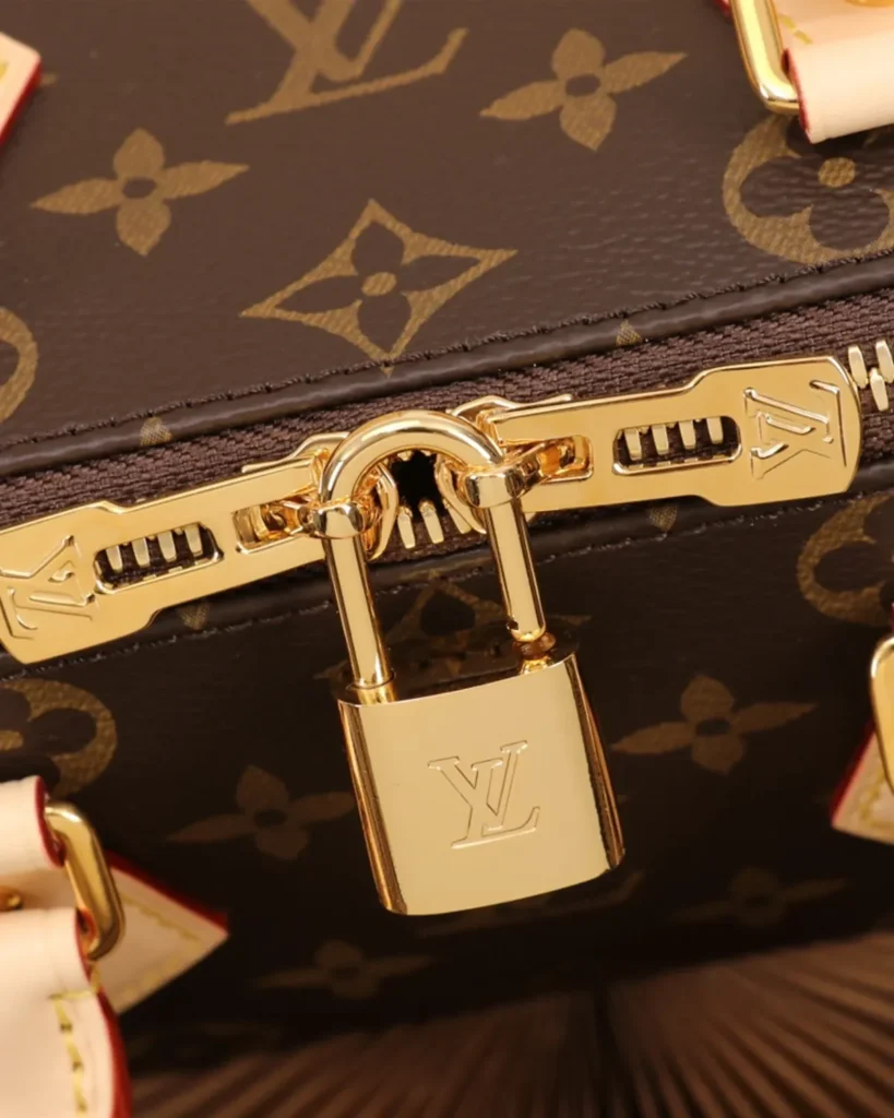 Brown Monogram Boston Bag with Wide Strap — zipper padlock view