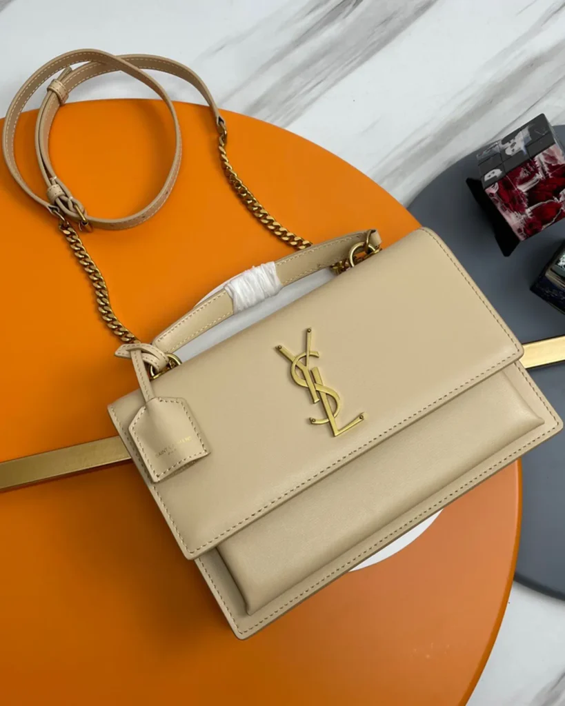 Cream Top-Handle Accordion Flap Bag — front view