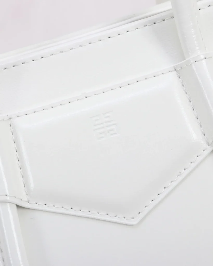 White Lock Detail Top Handle Bag — tab detail view