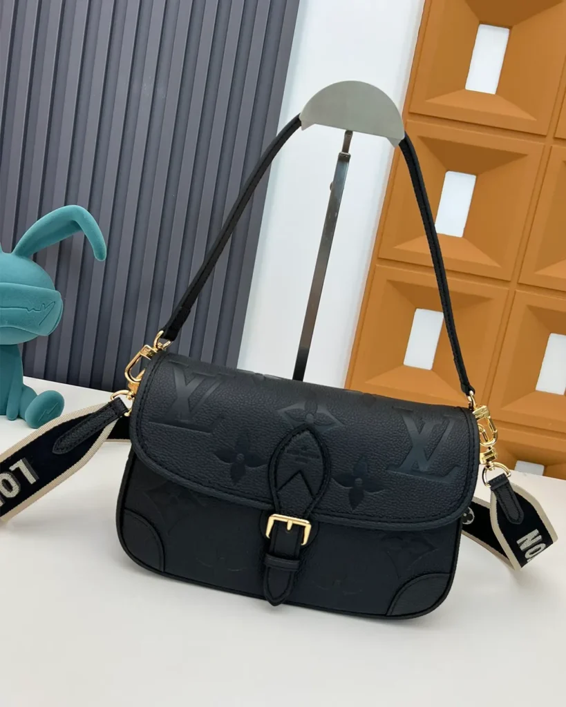 Black Embossed-Monogram Buckle Satchel — front view