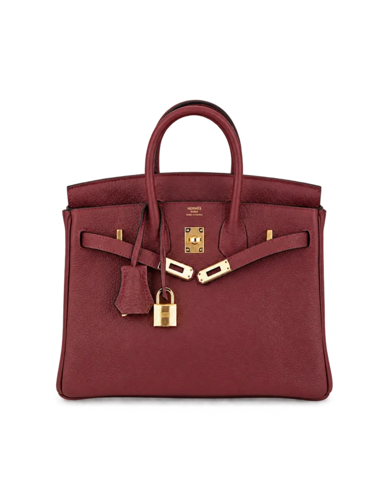 Upright front view of a burgundy grained-leather twin-handle bag with open closure straps and gold-tone lock hardware