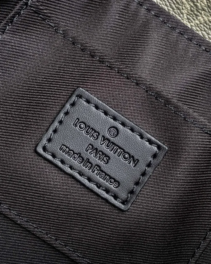 Black and Olive Monogram Flap Crossbody Bag — interior label view
