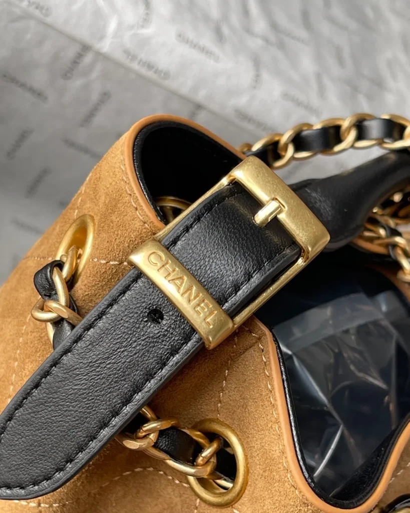 Tan and Black Quilted Chain Tote — strap buckle view