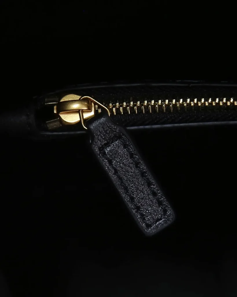 Black Curved-Top Shoulder Bag — zipper detail view