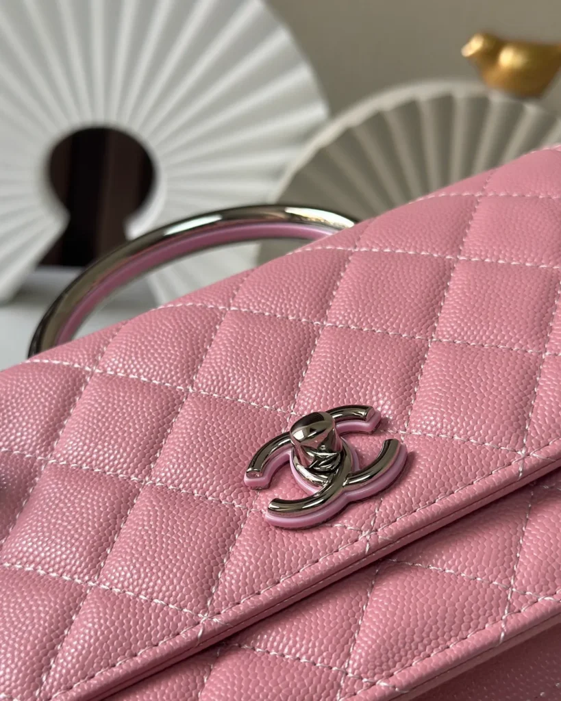 Rose Pink Quilted Top-Handle Chain Wallet — clasp detail view