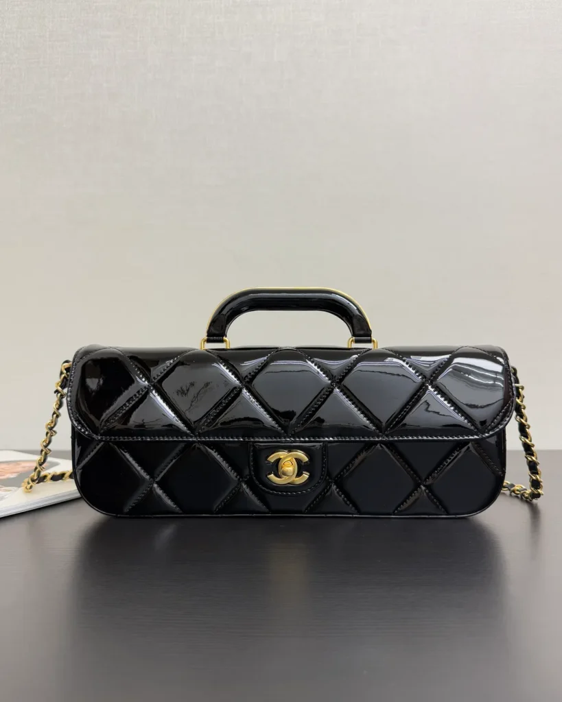 Glossy Black Quilted Handle Clutch — front view