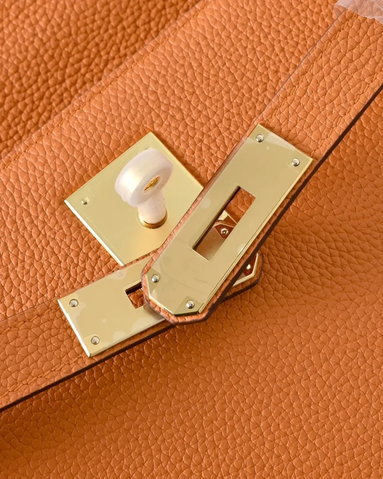 Kelly-Inspired 28 Orange Structured Top-Handle Bag, front turn-lock plates